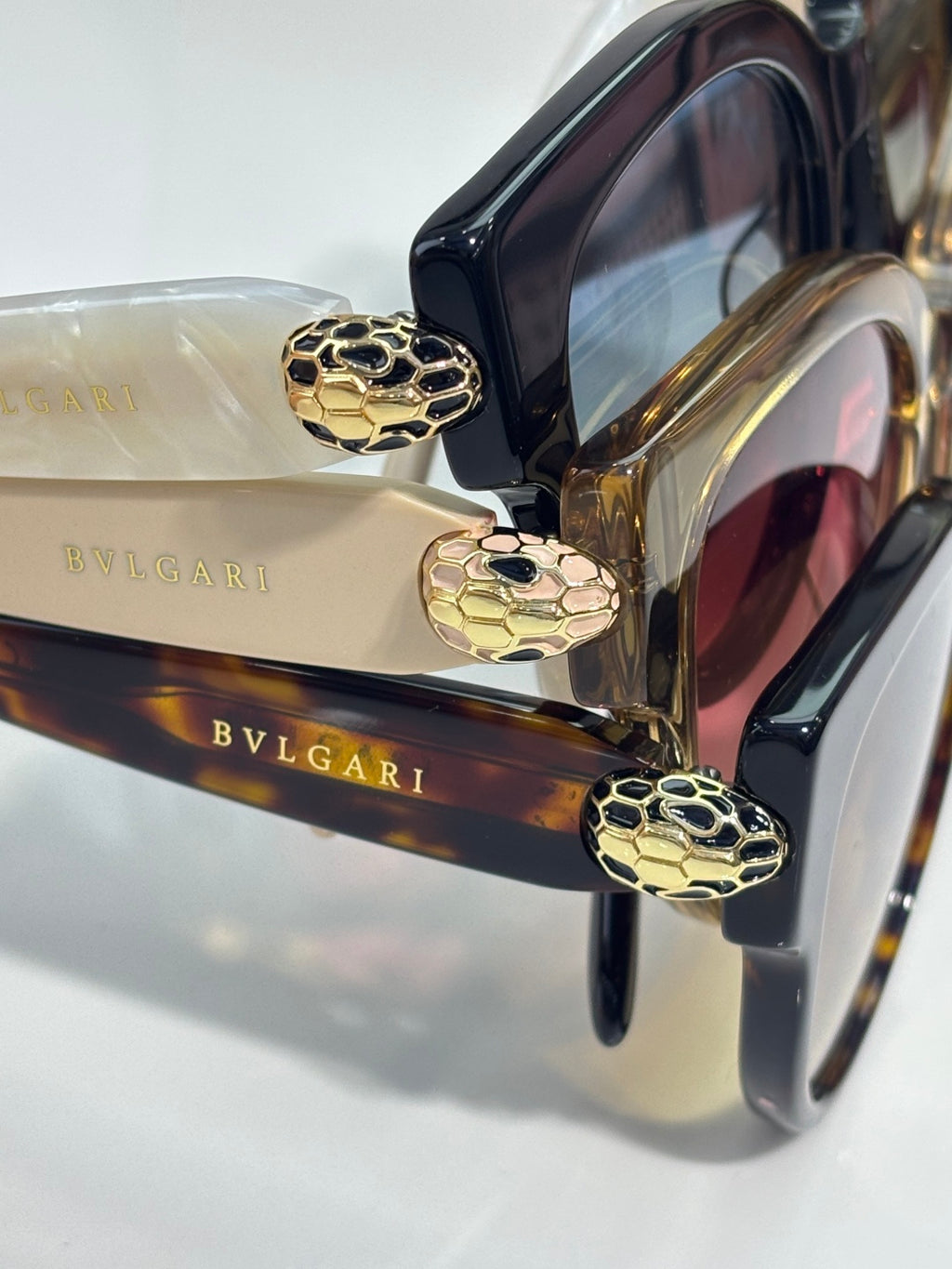 Bvlgari cat-eye sunglasses with gold temple details and dark lenses