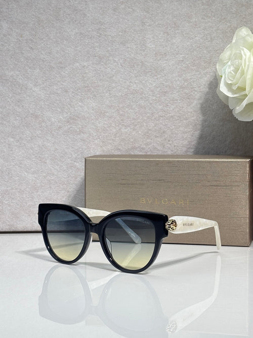 Bvlgari round cat-eye sunglasses with black frame and blue-green tinted lenses