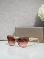 Bvlgari round cat-eye sunglasses with gold-tone frame and pink-tinted lenses