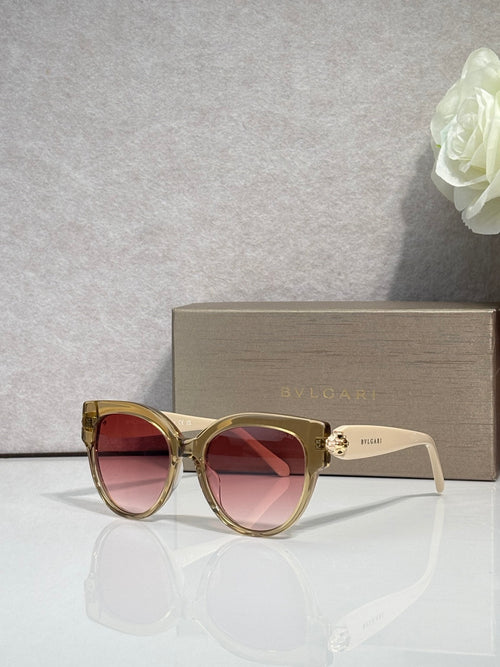 Bvlgari round cat-eye sunglasses with gold-tone frame and pink-tinted lenses