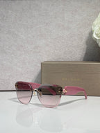 Bvlgari sunglasses with pink-tinted gradient lenses, burgundy frame and gold emblem