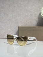 Bvlgari sunglasses with olive gradient lenses, light frame and gold emblem bridge