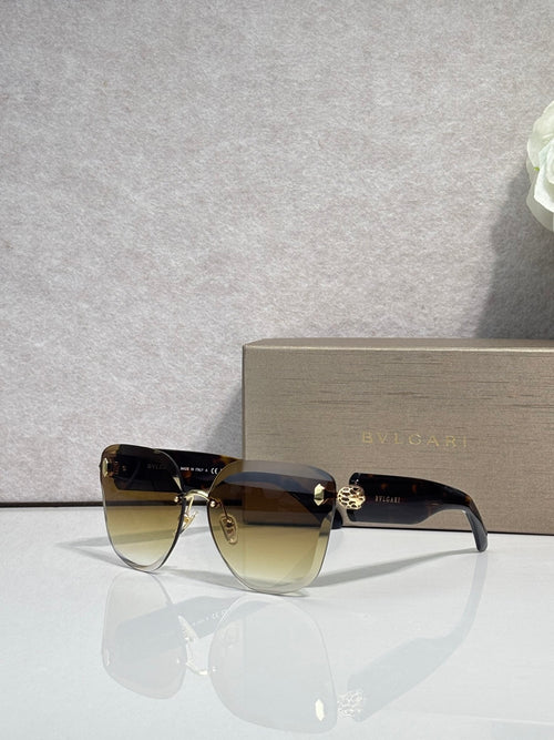 Bvlgari sunglasses with brown gradient lenses, dark frame and gold emblem bridge