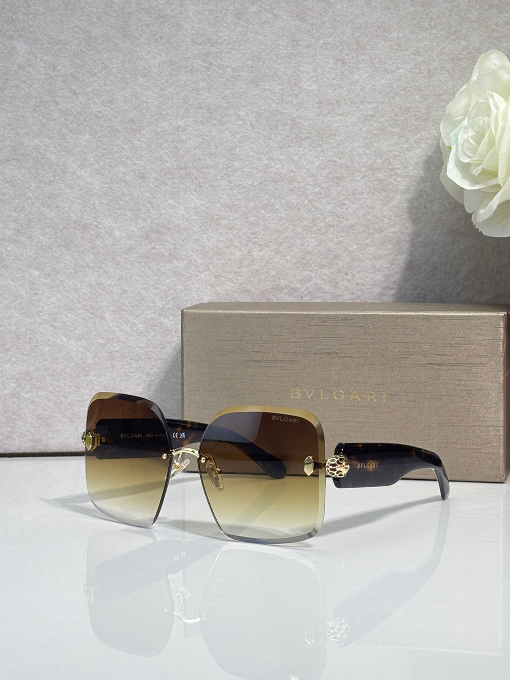 Bvlgari amber-brown gradient sunglasses with gold-tone hinges and dark lenses