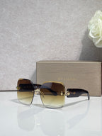 Bvlgari amber-brown gradient sunglasses with gold-tone hinges and dark lenses