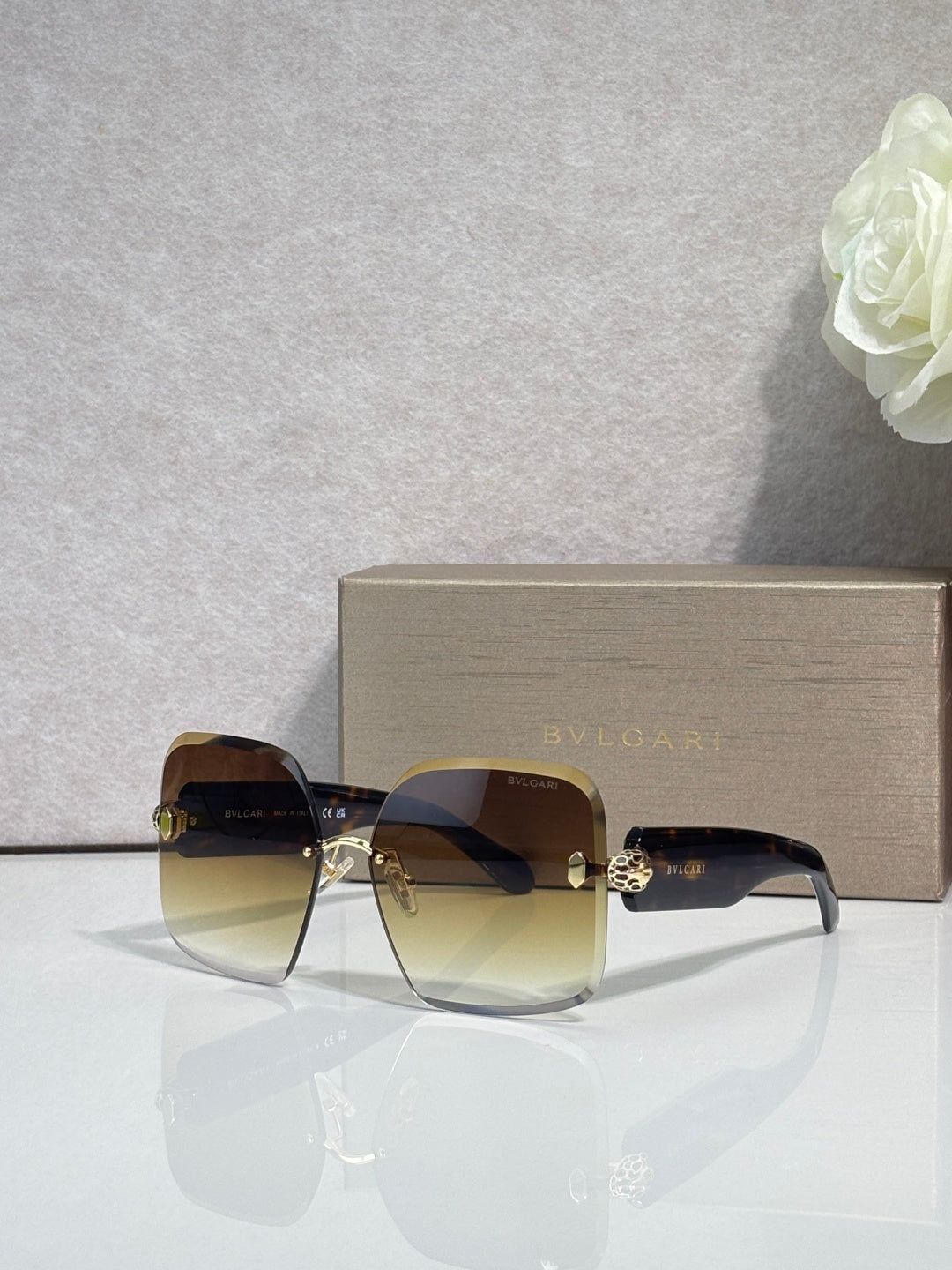 Bvlgari amber-brown gradient sunglasses with gold-tone hinges and dark lenses
