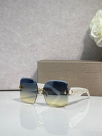Bvlgari blue gradient sunglasses with gold-tone hinges and translucent frame arms