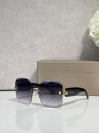 Bvlgari dark blue gradient sunglasses with gold-tone bridge and temple hardware