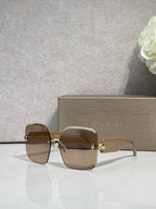 Bvlgari brown gradient sunglasses with gold-tone detailing and logo on arms