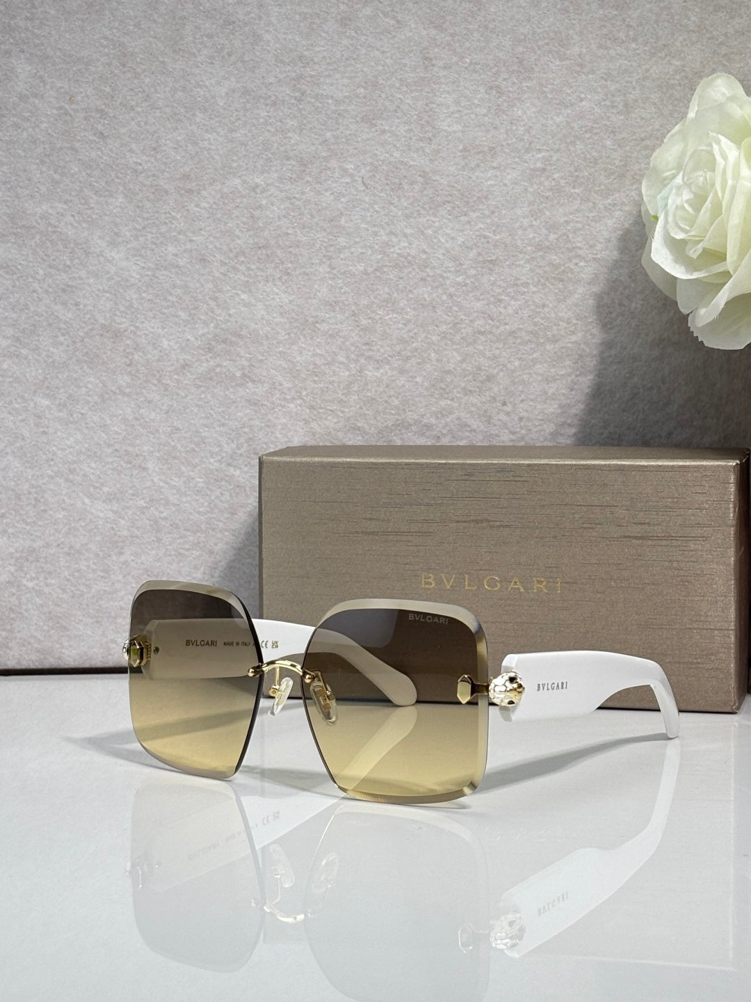 Bvlgari light gold gradient sunglasses with gold-tone hinges and logo temples