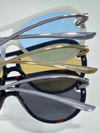 Bottega Veneta sunglasses frame close-up with blue and chrome temples