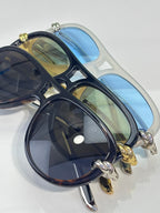 Bottega Veneta sunglasses with dark navy frame, tinted lenses, gold hardware