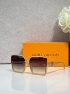 Louis Vuitton square sunglasses with dark lenses and tan frame, logo on arms