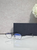 Round eyeglasses with blue-tinted lenses and black frame arms