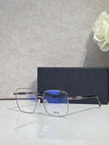 Dior eyeglasses with clear blue-tinted lenses and gold-tone metal frames