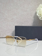 Dior eyeglasses with clear lenses, gold temples, and white front detail