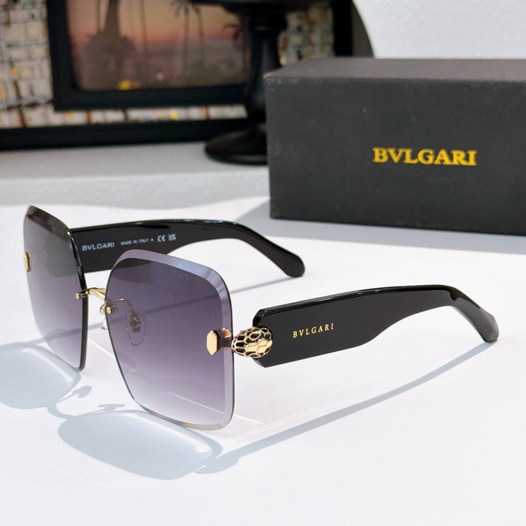Bvlgari black sunglasses with gradient lenses and gold logo hinge medallion