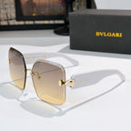 Bvlgari gold-tone sunglasses with tinted amber lenses and logo hinge medallion