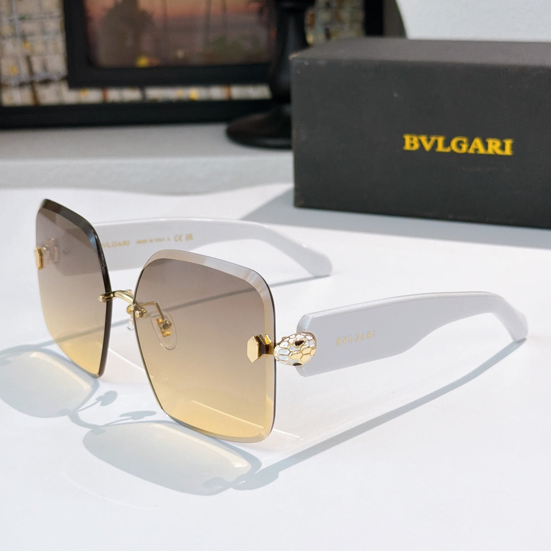 Bvlgari gold-tone sunglasses with tinted amber lenses and logo hinge medallion