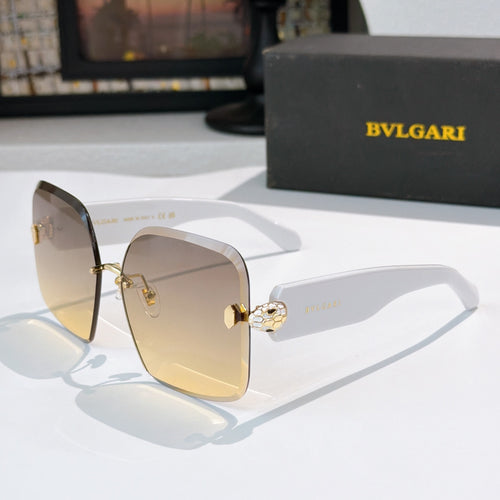 Bvlgari gold-tone sunglasses with tinted amber lenses and logo hinge medallion
