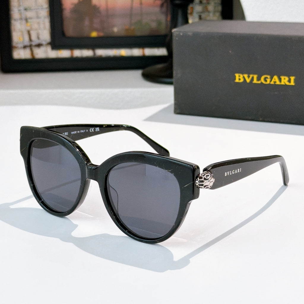 Sunglasses with black frames and dark tinted lenses, BVLGARI side logo