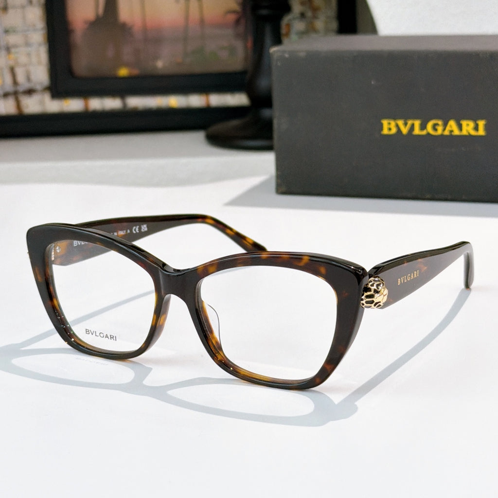 Tortoiseshell cat-eye eyeglasses with clear lenses and gold logo detail at the temple hinge