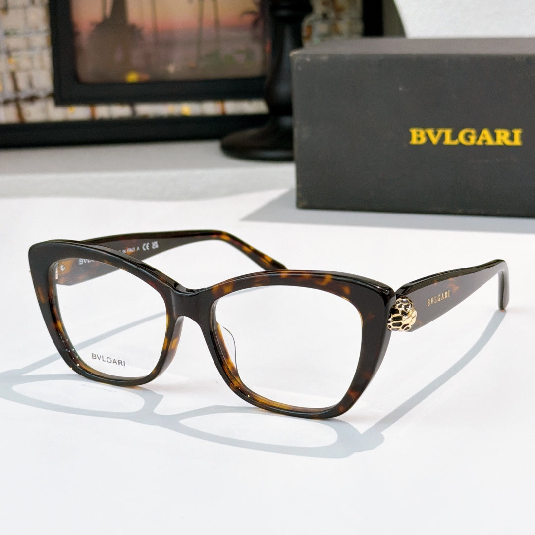 Tortoiseshell cat-eye eyeglasses with clear lenses and gold logo detail at the temple hinge