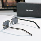 Prada eyeglasses side view with dark lenses and silver arms with metal hinge detail