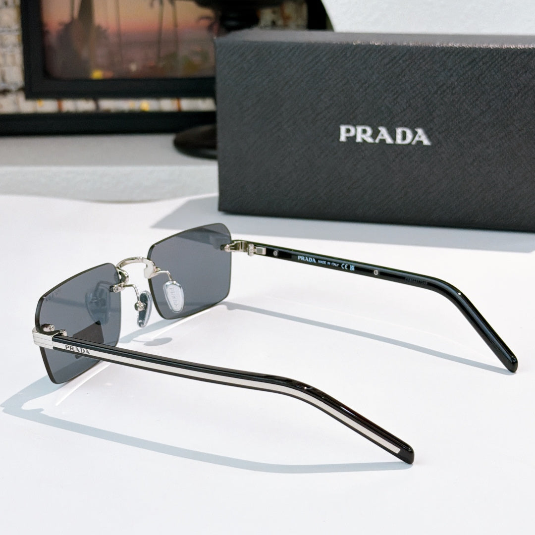 Prada eyeglasses side view with dark lenses and silver arms with metal hinge detail