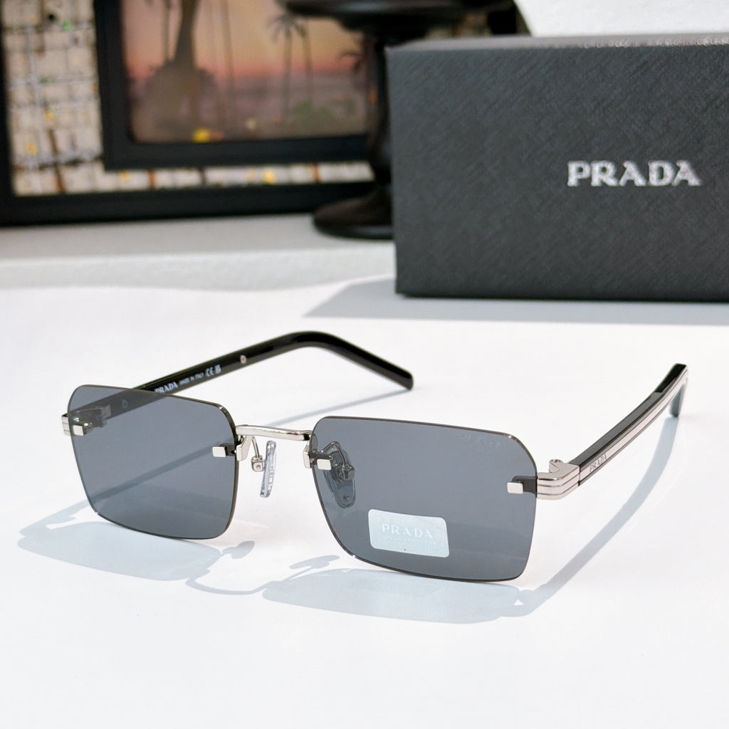 Prada eyeglasses with blue lenses, gold hinges, and black temple arms