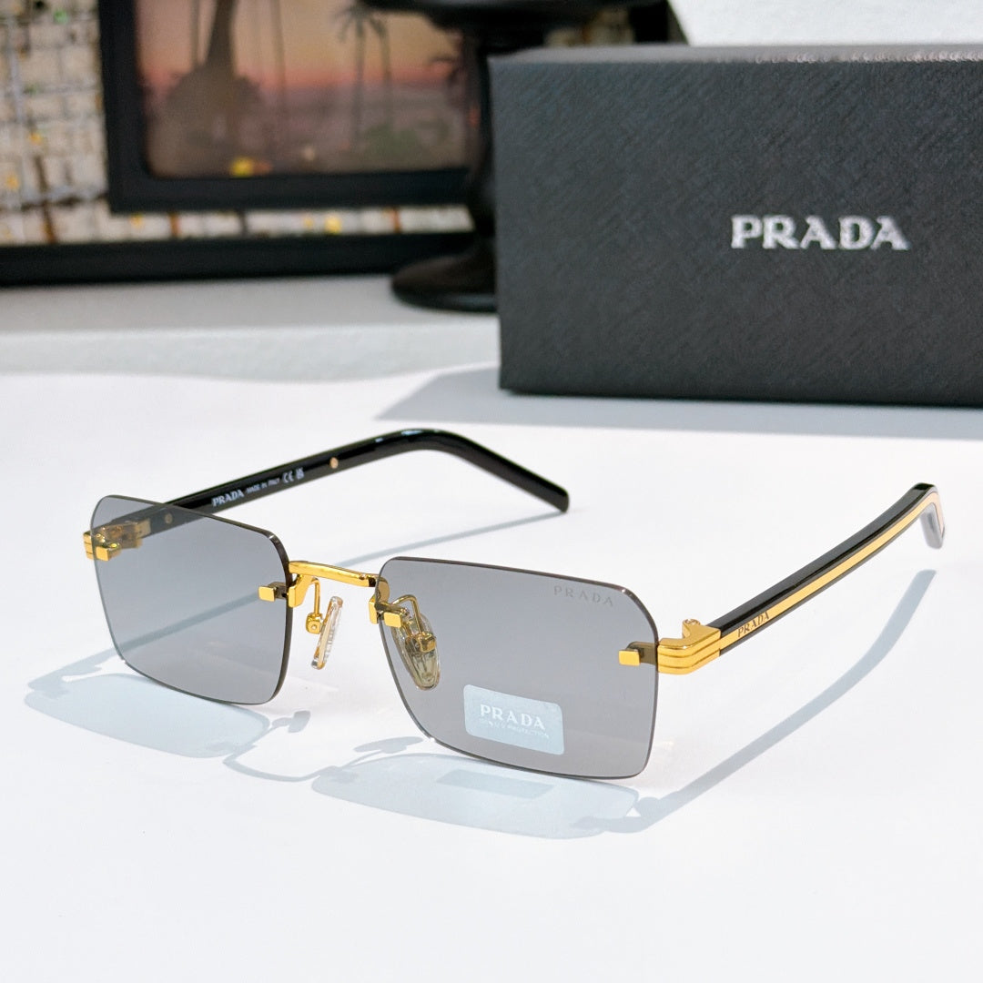 Prada eyeglasses with clear lenses, gold frame hardware, and tortoiseshell temple arms
