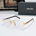 Prada eyeglasses with clear lenses and gold metal frame, black temple arms