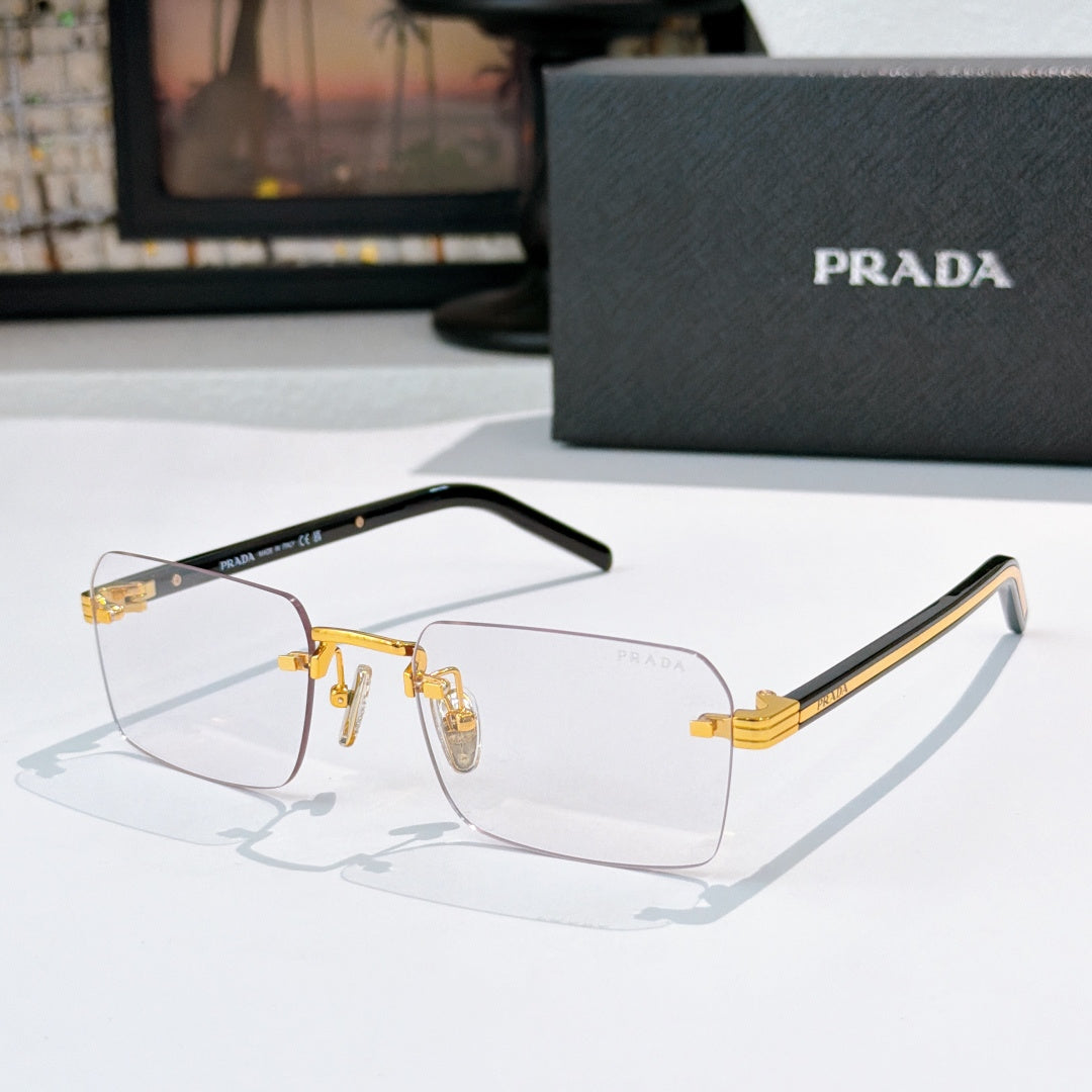 Prada eyeglasses with clear lenses and gold metal frame, black temple arms