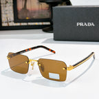 Prada eyeglasses with amber lenses, gold frame, and tortoiseshell temple tips