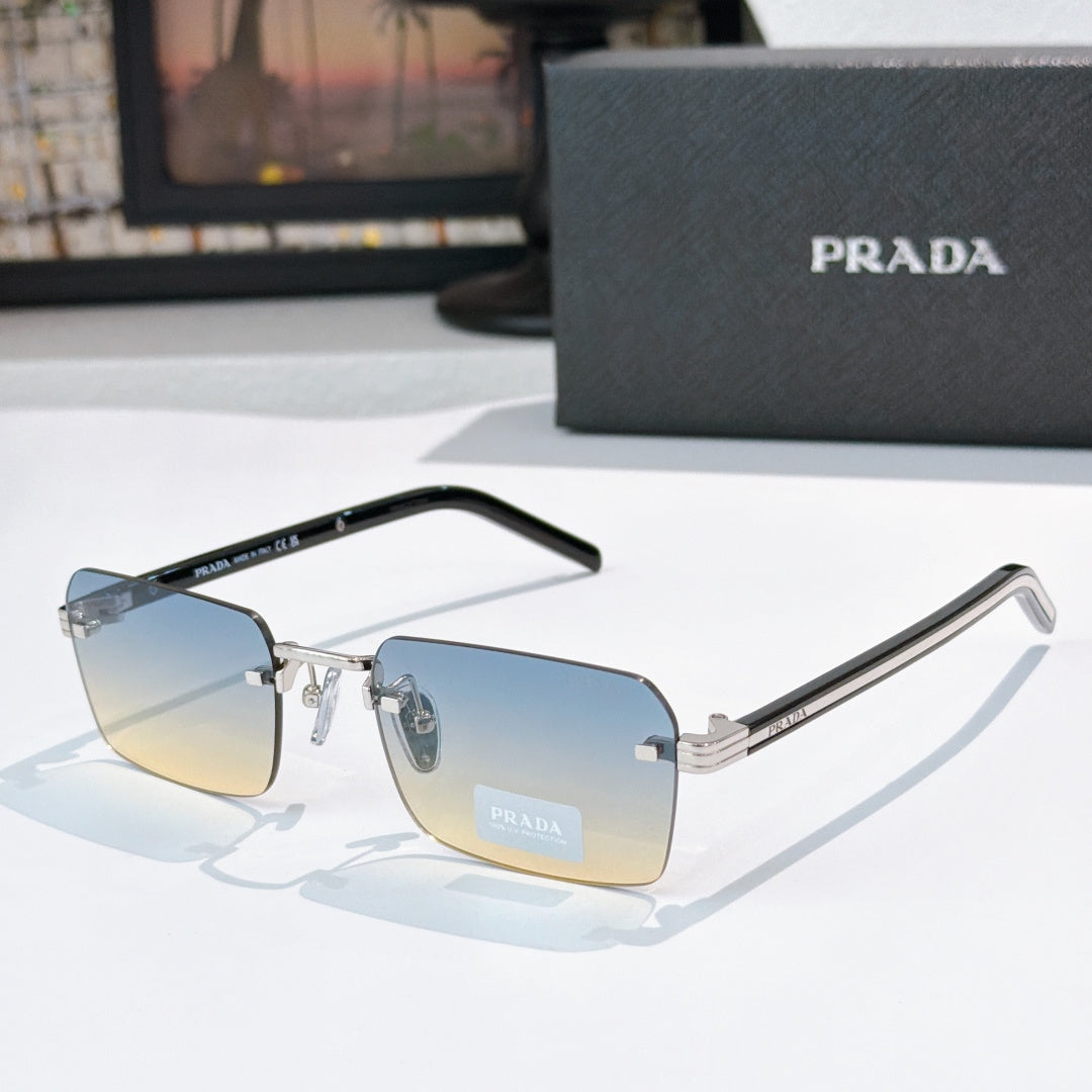 Prada eyeglasses with blue lenses, gold frame accents, and black temple arms