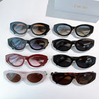 Assorted Dior sunglasses in multiple frame colors arranged on a display.