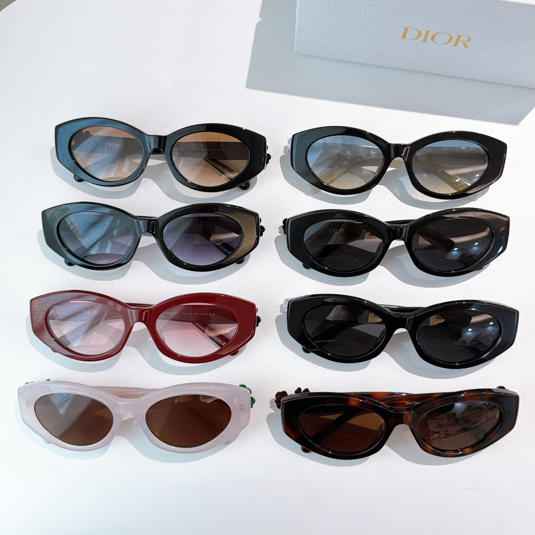 Assorted Dior sunglasses in multiple frame colors arranged on a display.