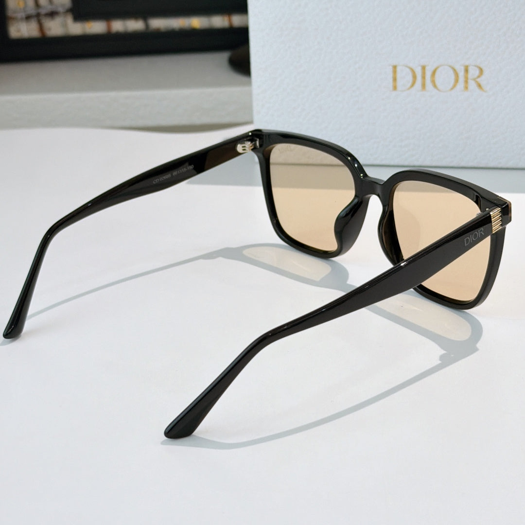 Cat-eye sunglasses angled view with beige lenses, black frame and gold stud hinge detail