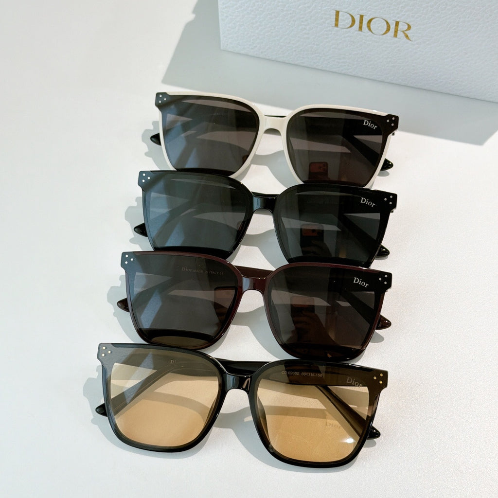 Set of four cat-eye sunglasses with tinted lenses in cream, blue, dark, and beige tones