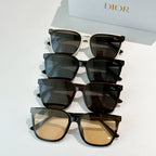 Set of four cat-eye sunglasses with tinted lenses in cream, blue, dark, and beige tones