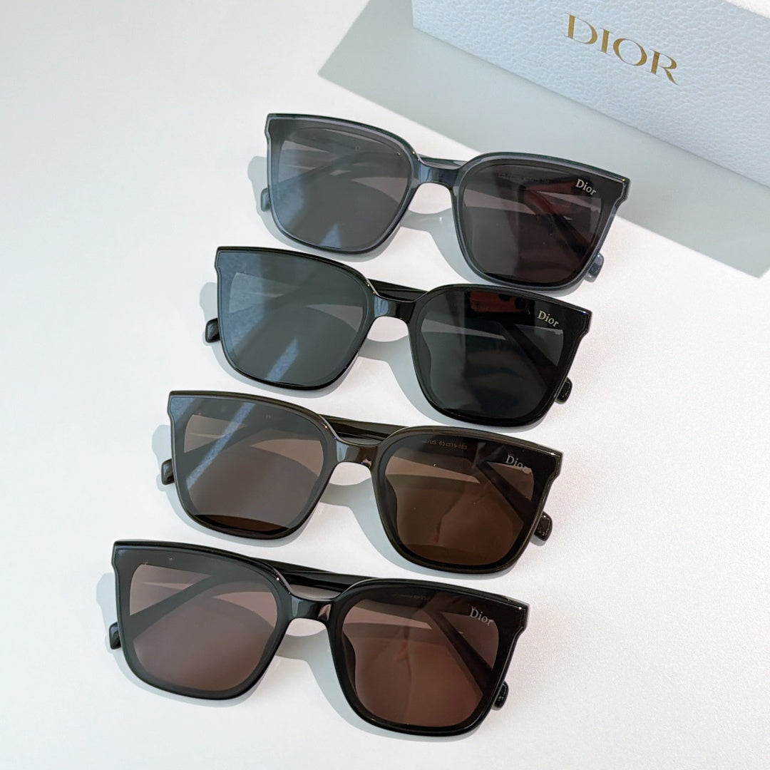 Set of Dior sunglasses with dark, brown, and blue-tinted lenses and black frames