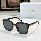Dior sunglasses, black frame with dark smoke lenses and gold-tone hinge