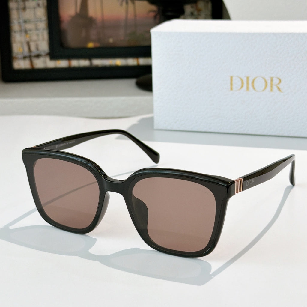 Dior sunglasses, black frame with rose-tinted lenses and gold-tone hinge detail