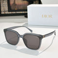 Dior sunglasses, black frame with dark brown lenses and gold-tone logo detail