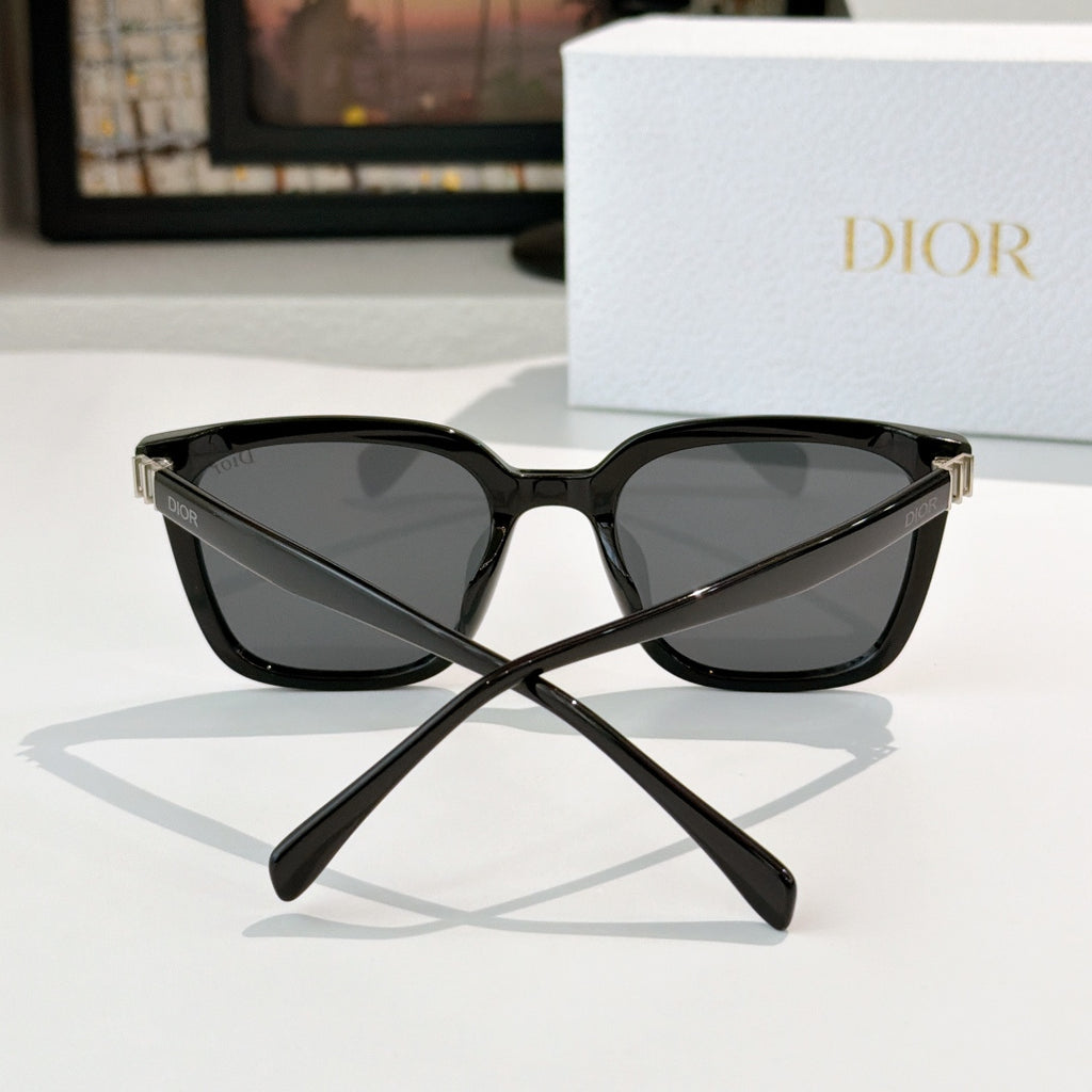 Dior sunglasses, black cat-eye frame with dark lenses and gold-tone hinge