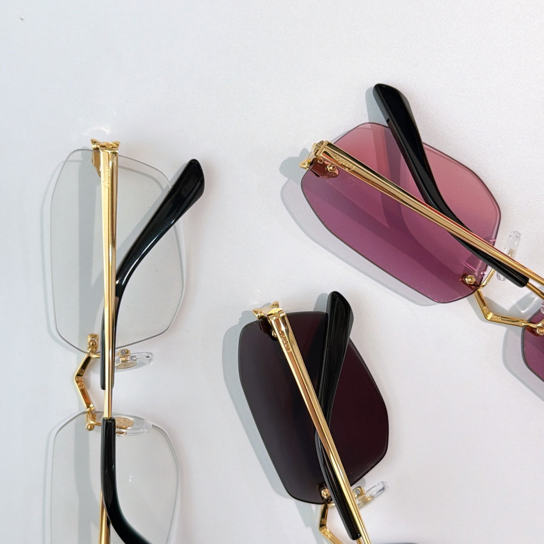 Cartier eyeglasses close-up: gold frames, black temple tips, pink and clear lenses.