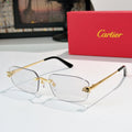 Cartier eyeglasses with clear lenses and gold metal frame, black temple tips.