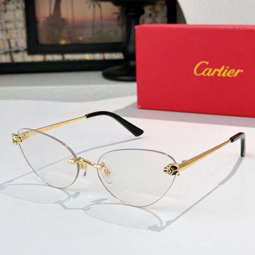 Gold-tone sunglasses with clear lenses and black temple tips, slim round cat-eye frame