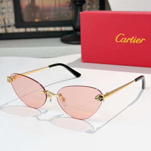 Gold-tone sunglasses with pink-tinted lenses and black temple tips, slim cat-eye frame