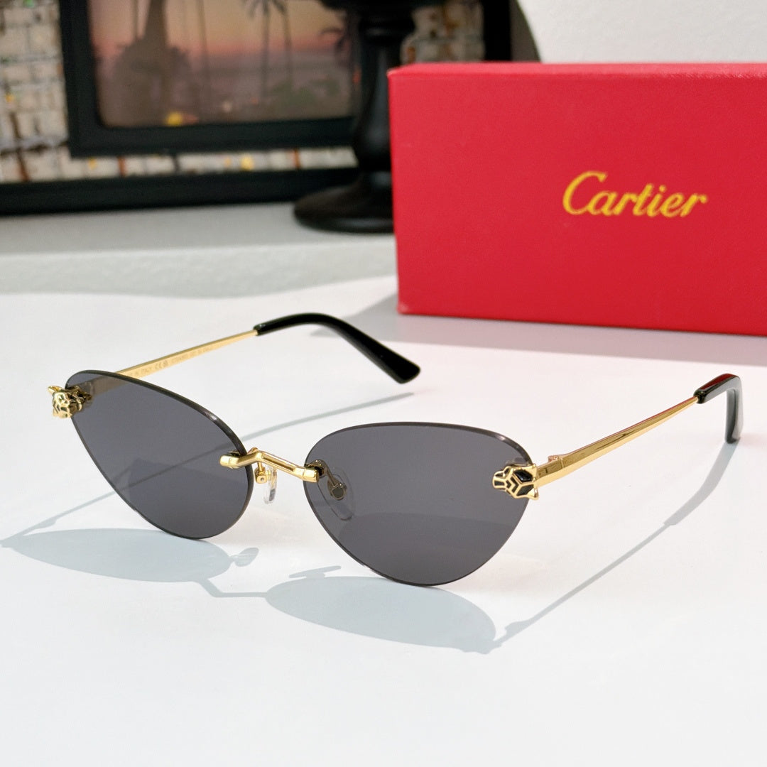 Gold-tone sunglasses with dark gray lenses and black temple tips, slim cat-eye frame